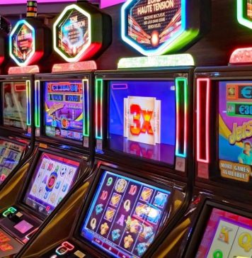Top Online Casino Games Of 2022 A Row of Slot Machines