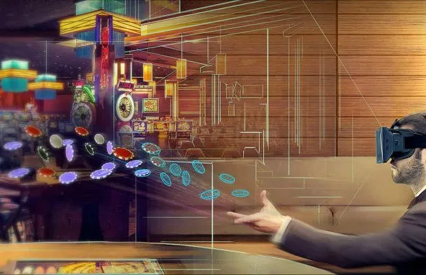 A man with a VR Game headset on, siting at a table and throwing poker chips.