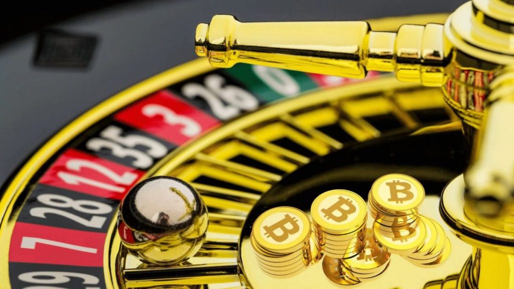 Gold roulette wheel with little gold Bitcoins. 