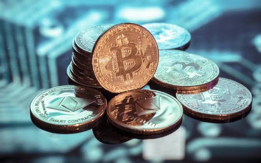 Bitcoin and Ethereum coin all stacked on a pile.