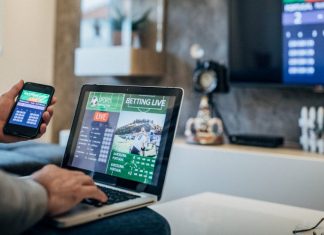 The Growth Of Sports Betting Online Someone sitting and sports betting online